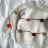 Let's Christmas Sweater available PetiteKnit I Double Sunday fra Sandnes Garn, hvit modell