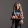 Tooti av Nina Born / Mininit, designet for Filcolana- kolleksjonen More Women Høst 2026. Helmønstret genser strikket i Arwetta og Alva