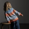 Tooti av Nina Born / Mininit, designet for Filcolana- kolleksjonen More Women Høst 2026. Helmønstret genser strikket i Arwetta og Alva