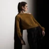 Stine av Stine Radicke / Stine Radicke Knitwear Design, designet for Filcolana- kolleksjonen More Women Høst 2026. Off-shoulder genser, strikket i Peruvian og Tilia.